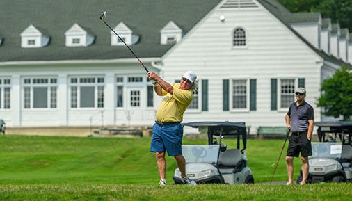 Golfer teeing off at the Golf Classic